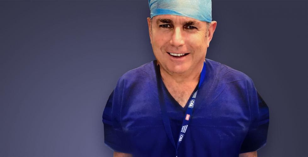 Prof Steadman in scrubs, superimposed onto background